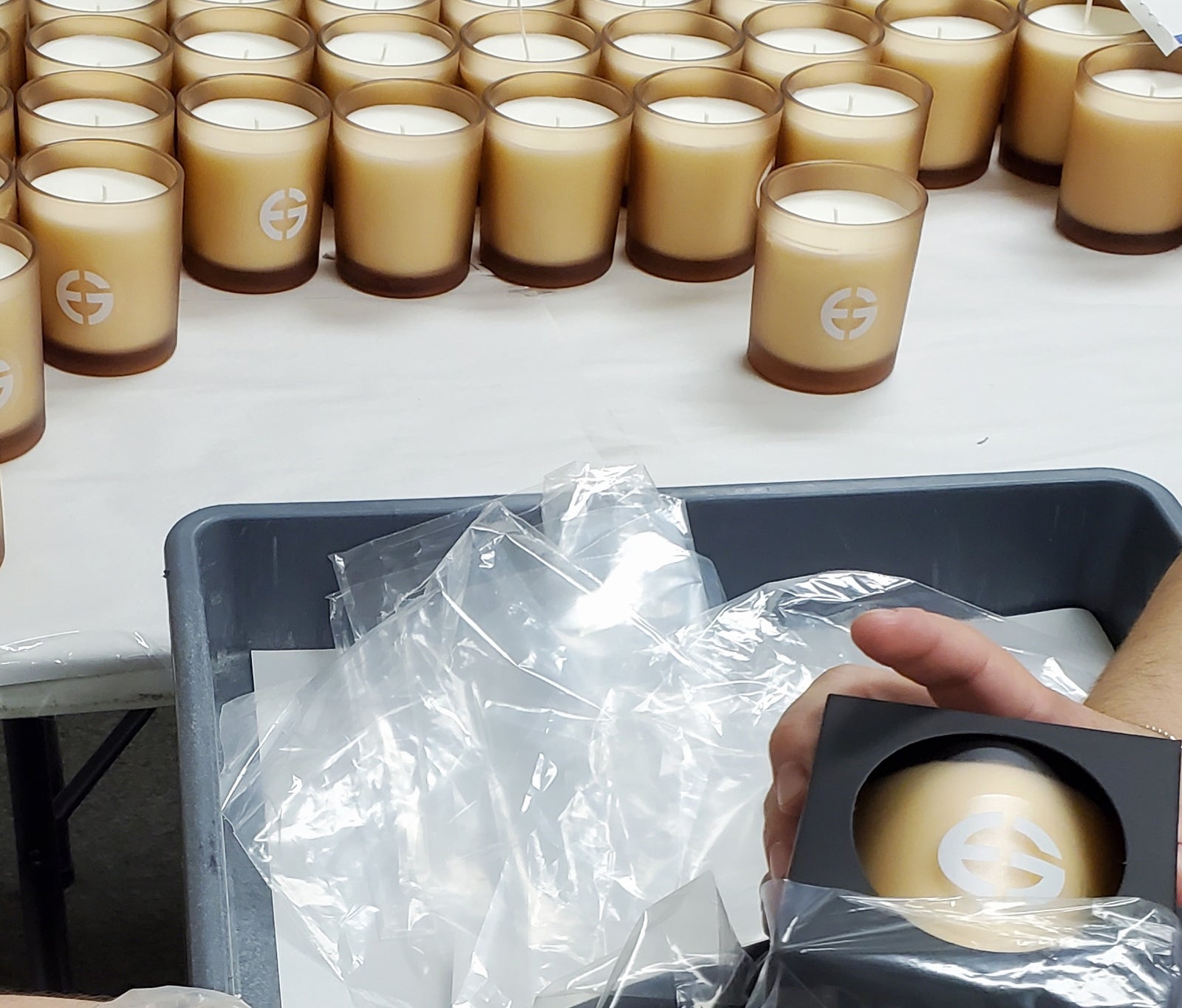 Private label candles lined up in the studio